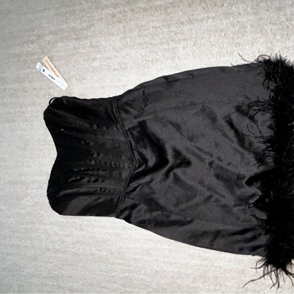 Aqua strapless feather dress.